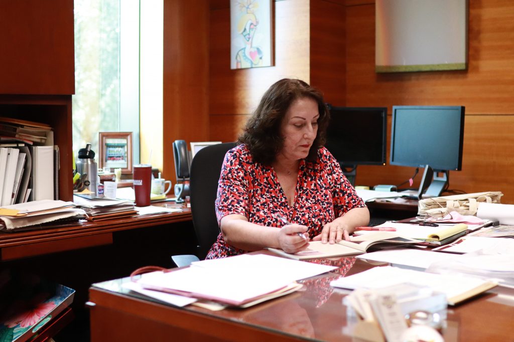 Vice President Rosanne Palacios reviews work in her office.