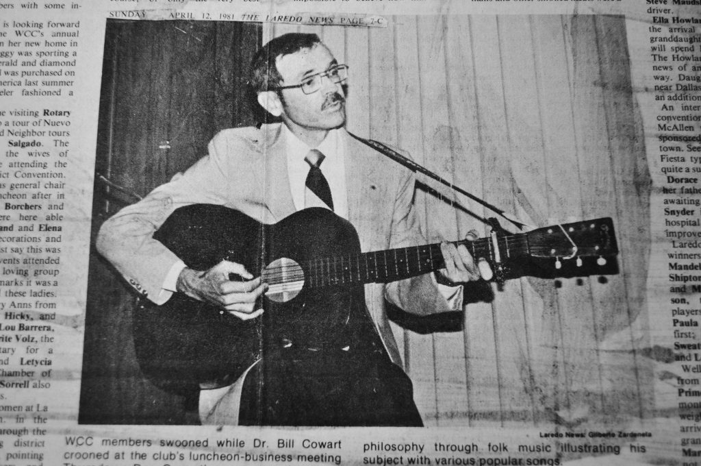 Former President Cowart plays the guitar in a newspaper file image