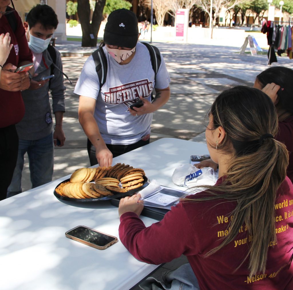 Students grab cookies during Maroon Monday.
