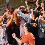 The crowd reaches for swag.