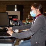 Senior Rosalinda Pescina works on coding