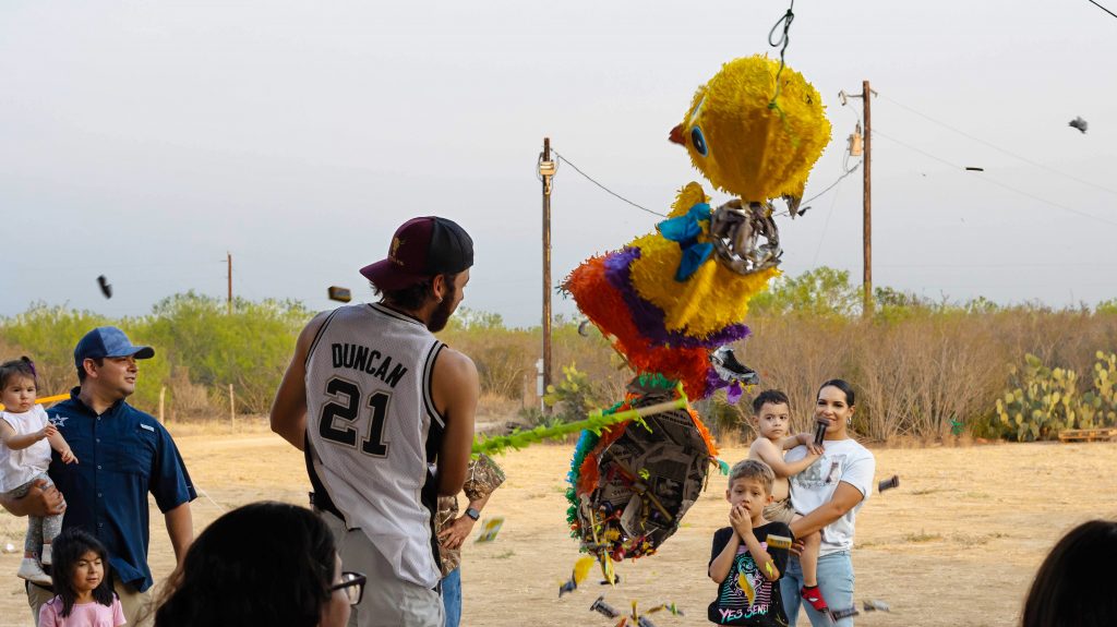 Unidentified man hits piñata