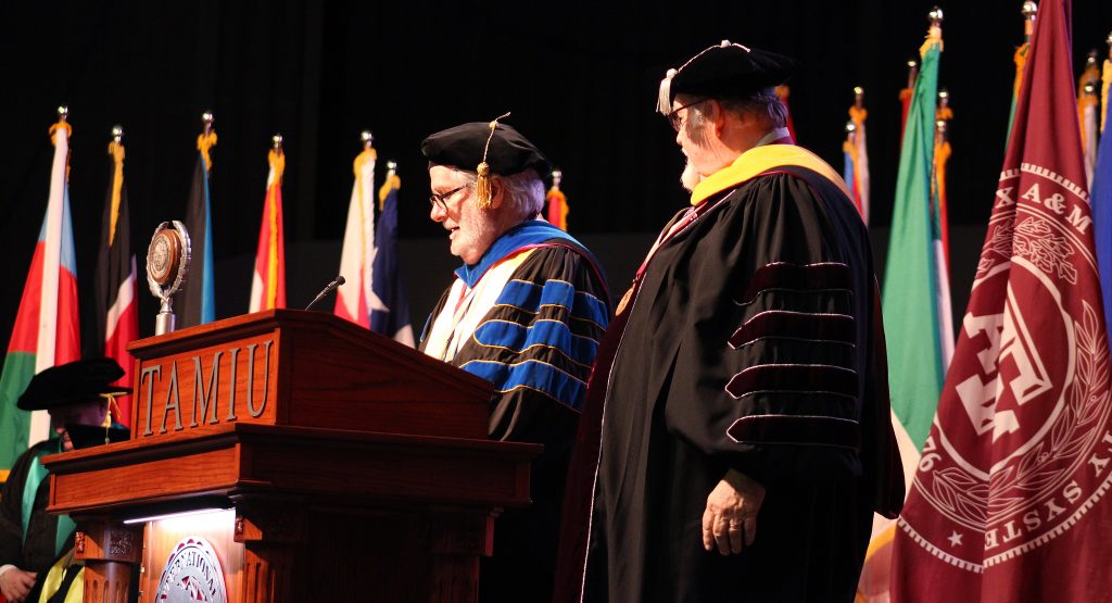 Provost Thomas Mitchell and President Pablo Arenaz introduce a speaker during commencement