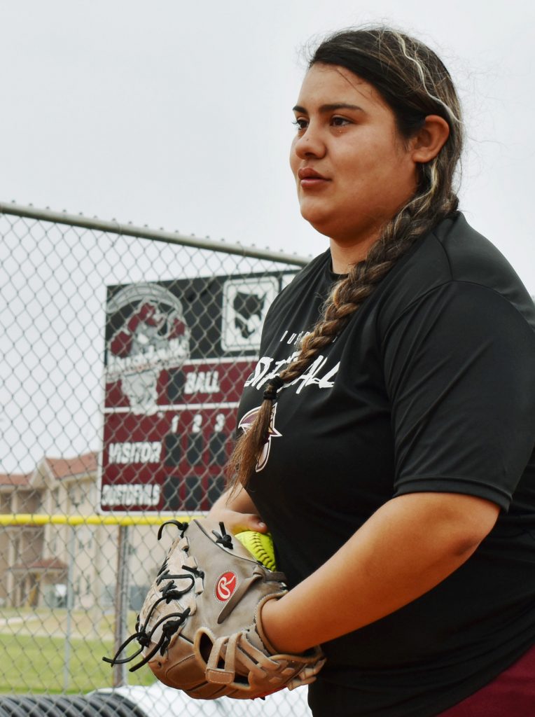 softball pitcher Erika Cortez with glove and softball in hand