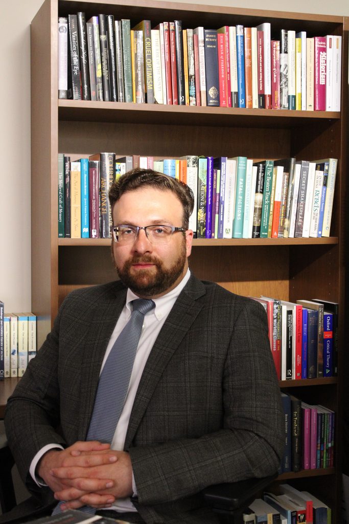 Professor Adam Kozaczka in his office at TAMIU