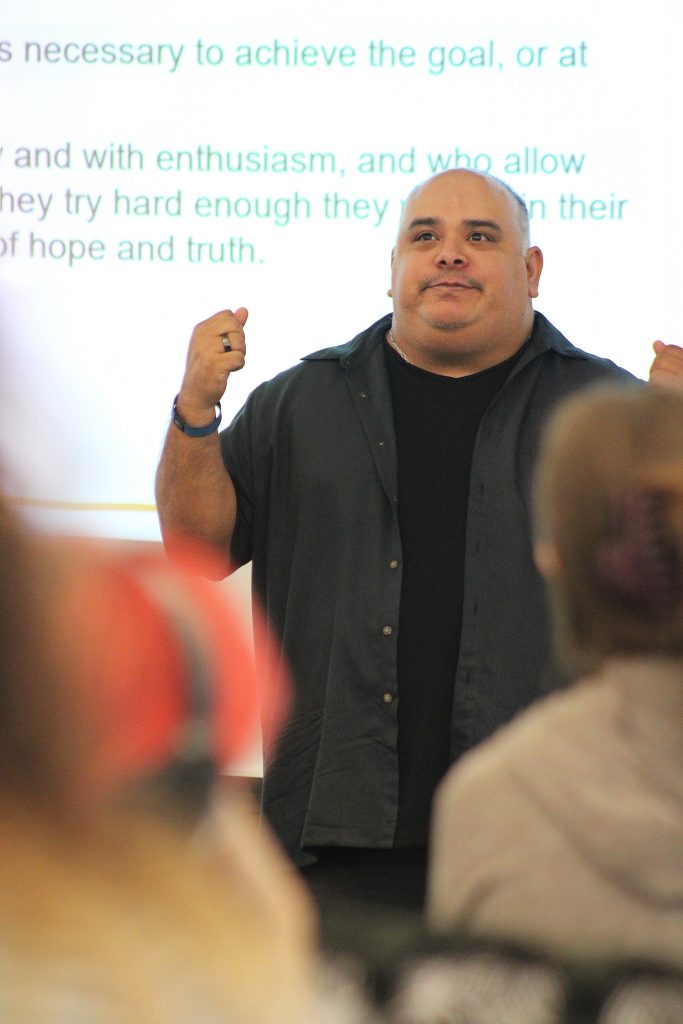 Professor Martinez speaks to his students during theater class
