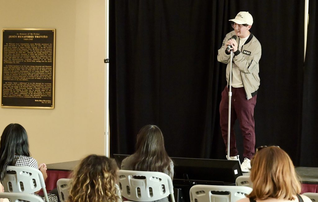 A student sings a song in karaoke.