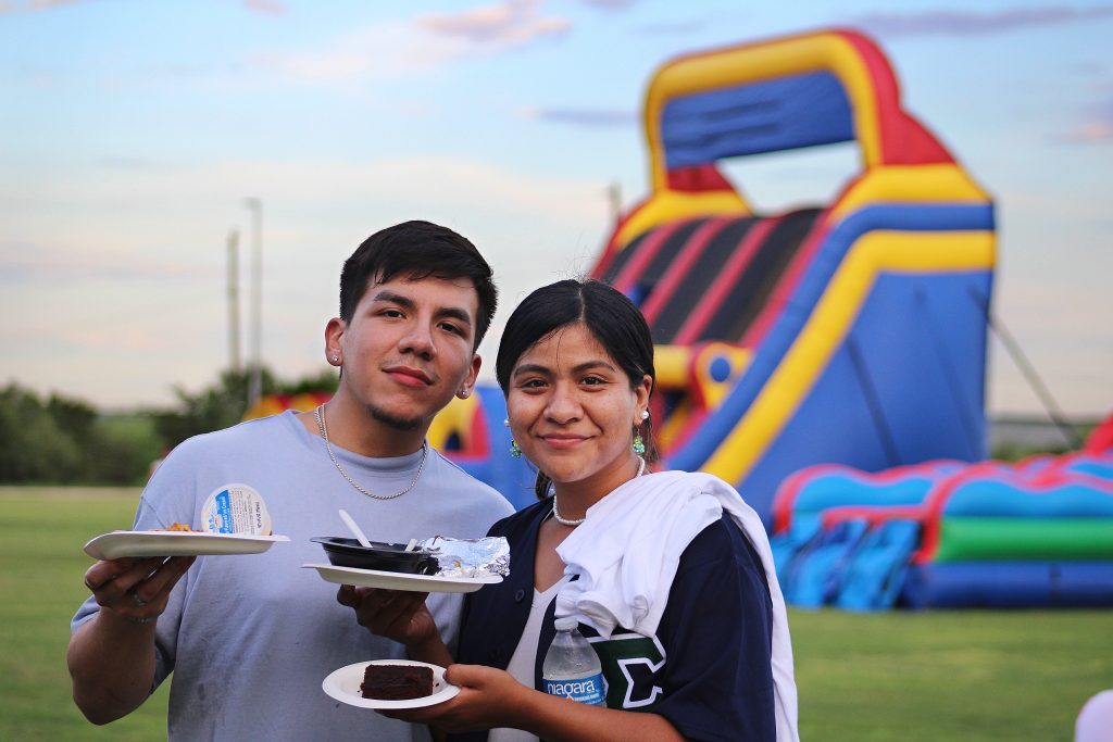 Two students pose for a photo at CABchella