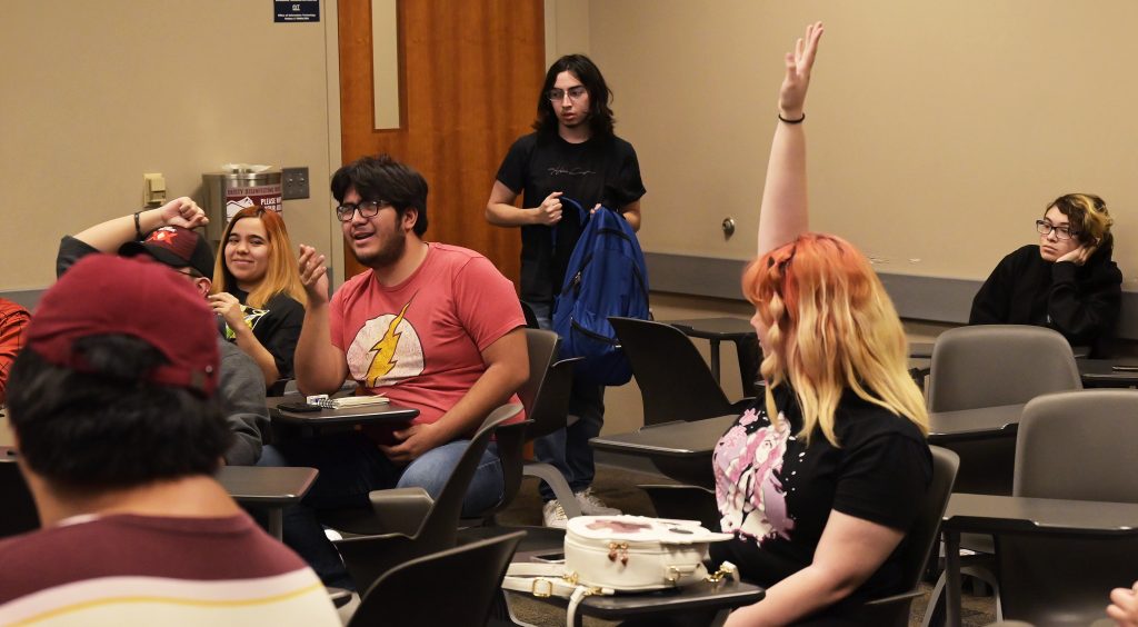 Anime Club members compete in a Jeopardy-style game.