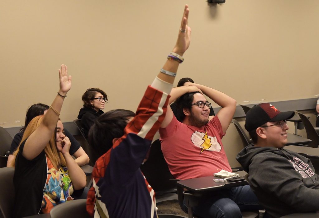 Anime Club members compete in a Jeopardy-style game.