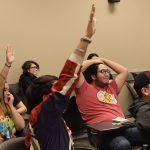 Anime Club members compete in a Jeopardy-style game.
