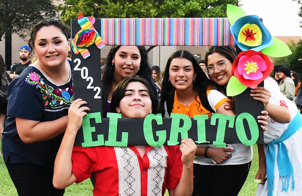 CAB members hold an El Grito sign