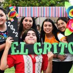 CAB members hold an El Grito sign