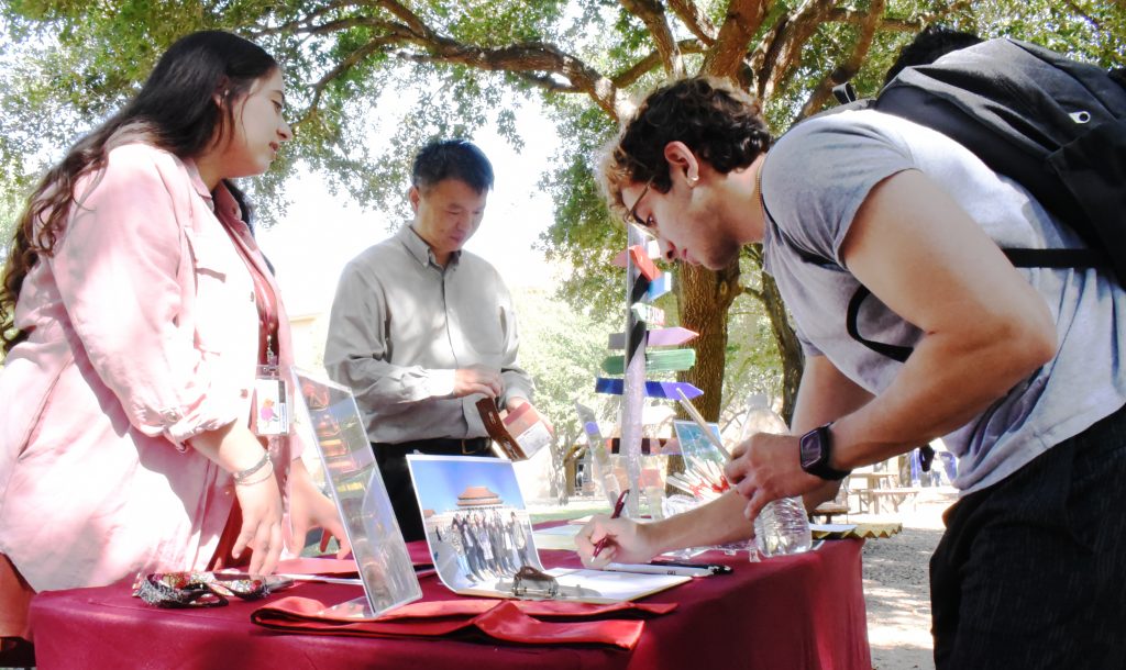 Assistant Professor Yong Chen recruits students for a study abroad program to China