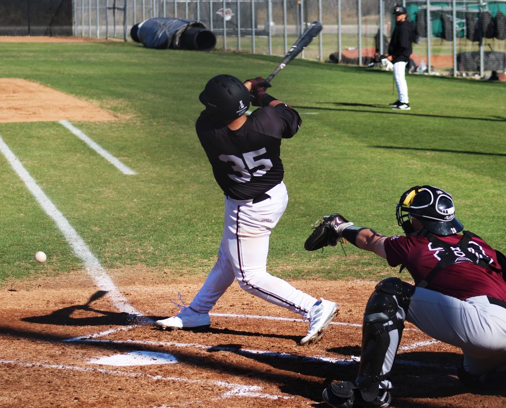 TAMIU batter connects with the ball
