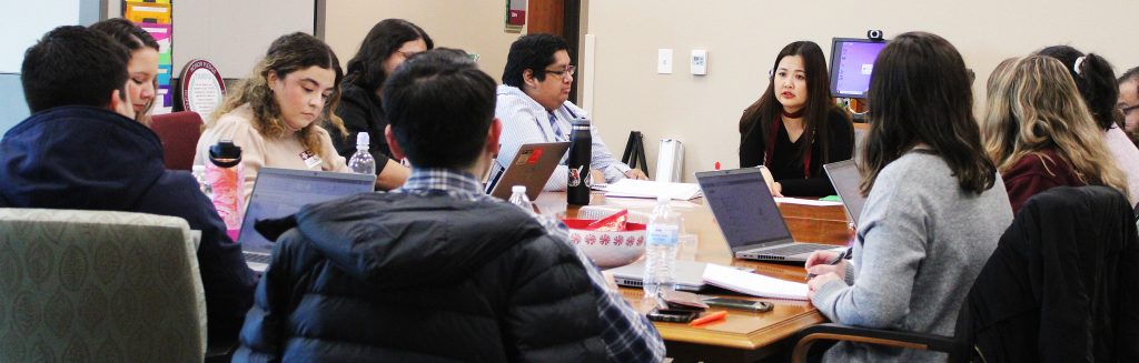 University College Dean Barbara Hong meets with her staff