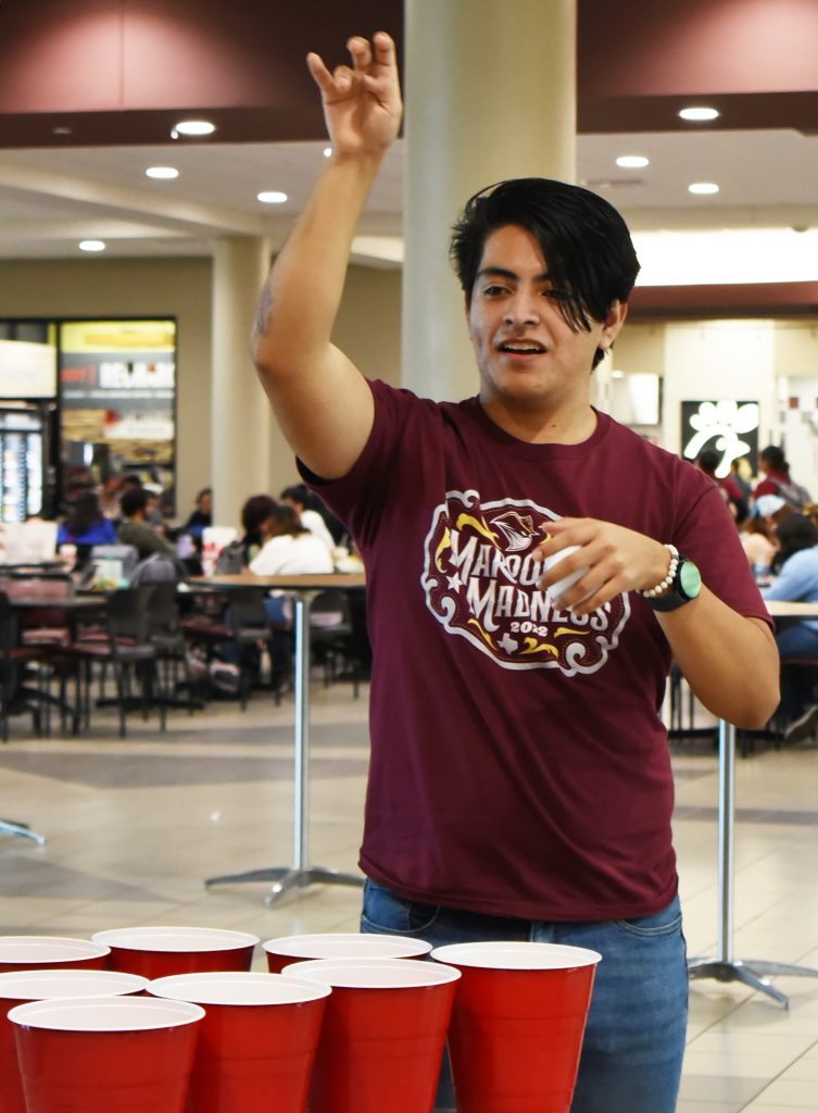 Student playing a pong game