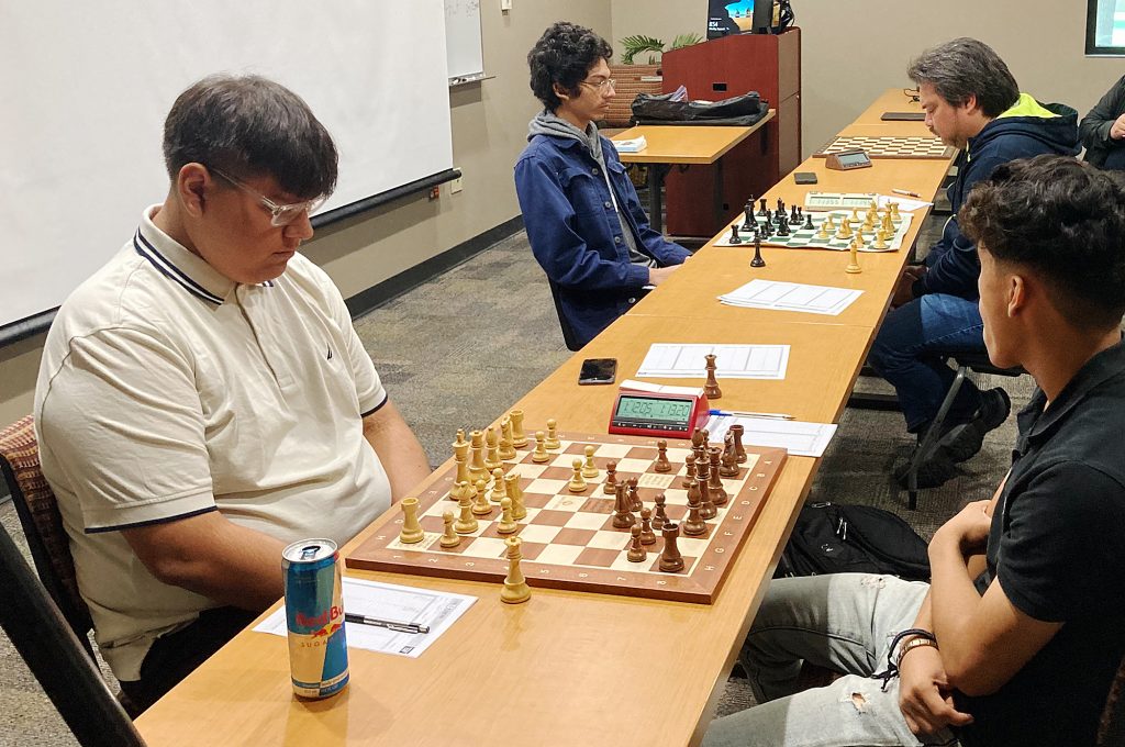 Four contestants in chess.
