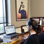 Professor Moran works in her office.