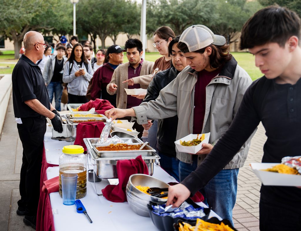 Students line up for food at the Barbie-Q