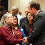 New TAMIU president shakes hands as he is welcomed on campus.