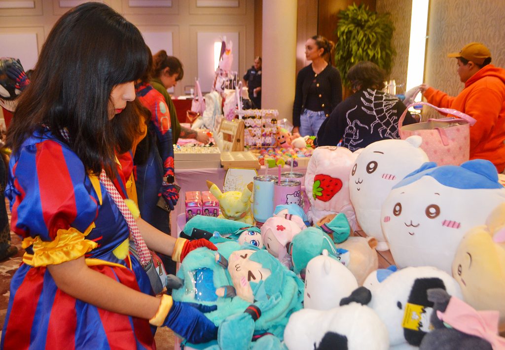 People look at stuffed animals at the Comicon event in the Student Center Ballroom.
