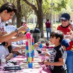 Students and visitors play a game during the Discover TAMIU event.