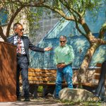 Planetarium reopening - University leaders stand and talk at a podium