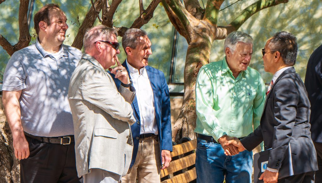 University officials talk to one another outside of the Planetarium.