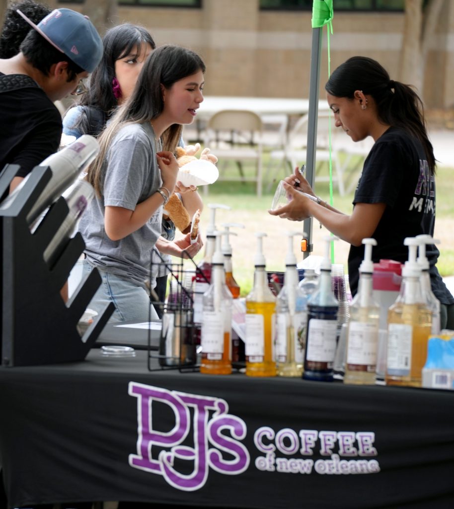 students get flavored coffee during the block party