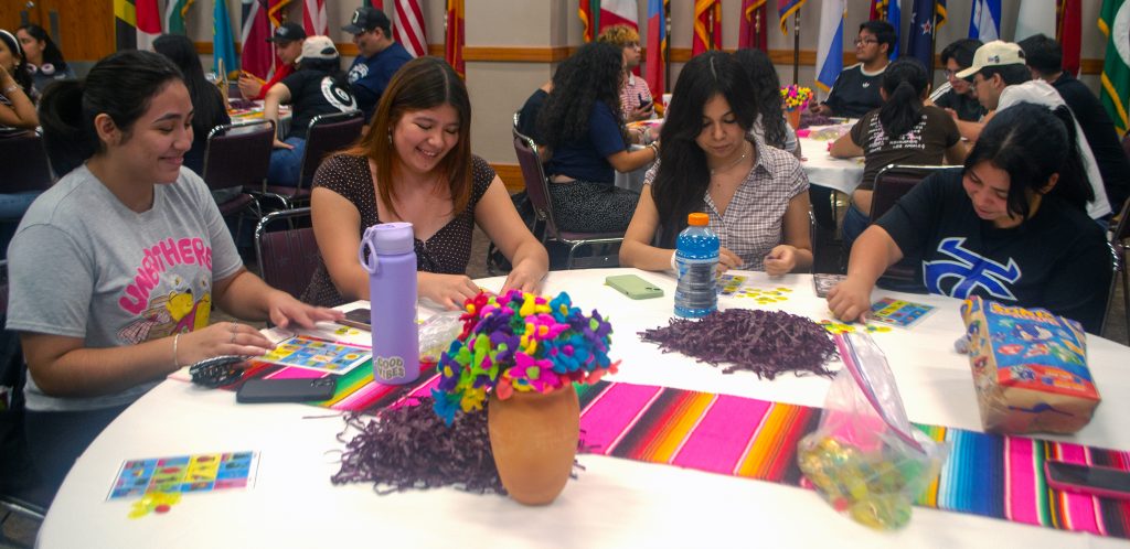students play Loteria, a Mexican cultural game similar to bingo.